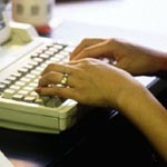 woman typing on computer
